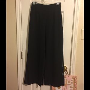 Black slacks surrounded by sheer paneling